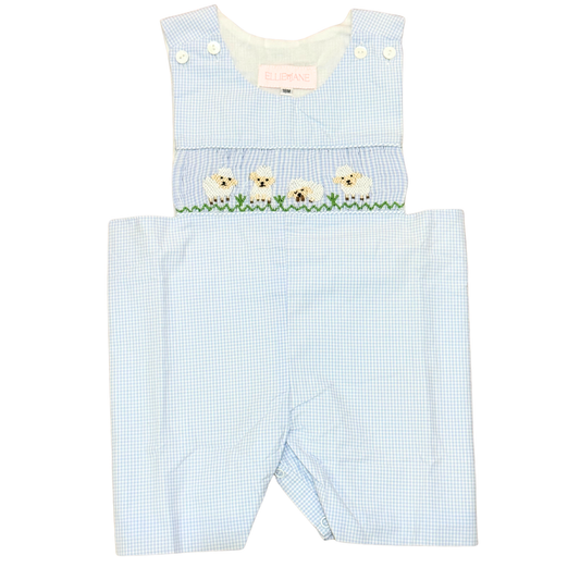 Light blue checkered romper with embroidered dogs on a white background
