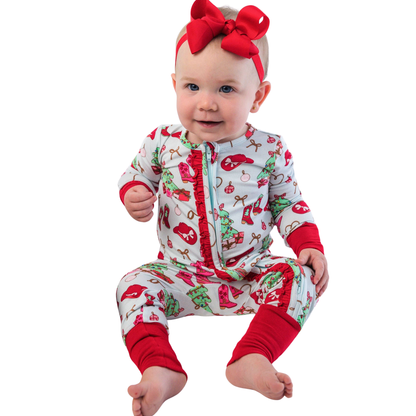 Baby wearing a Cowboy Christmas-themed onesie with red accents on a white background