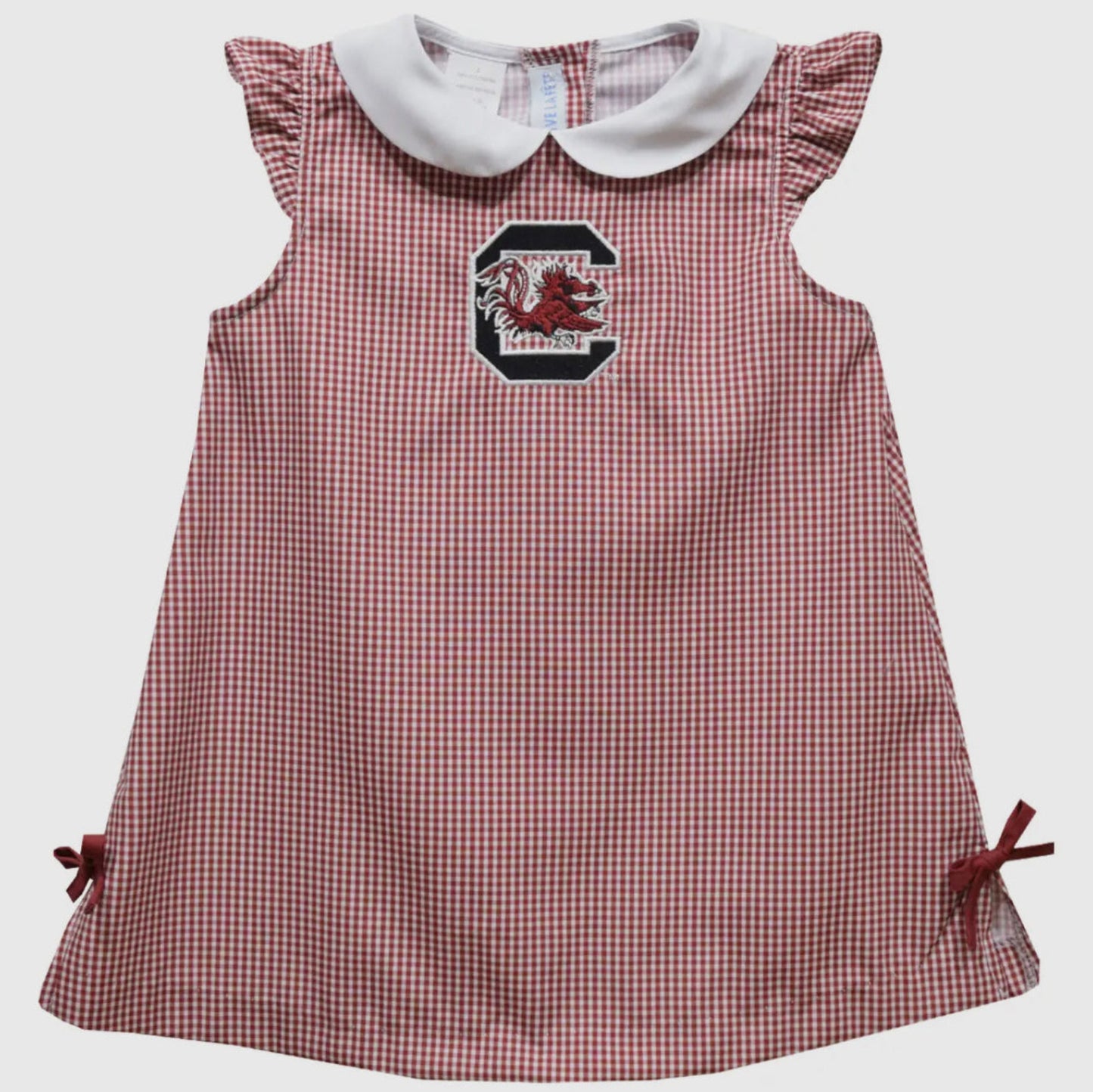 Red and white checkered dress with a logo on a light gray background