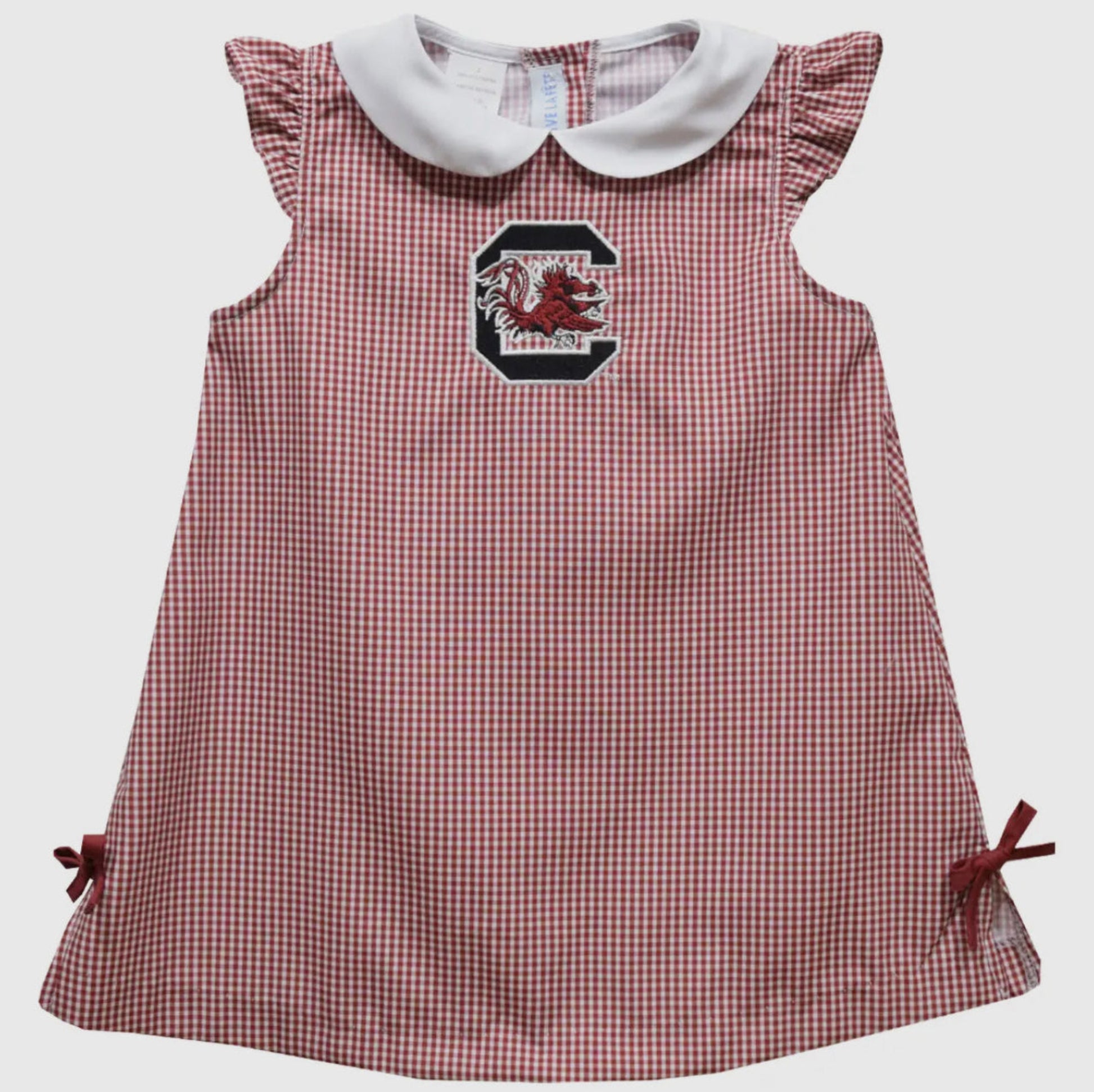 Red and white checkered dress with a logo on a light gray background
