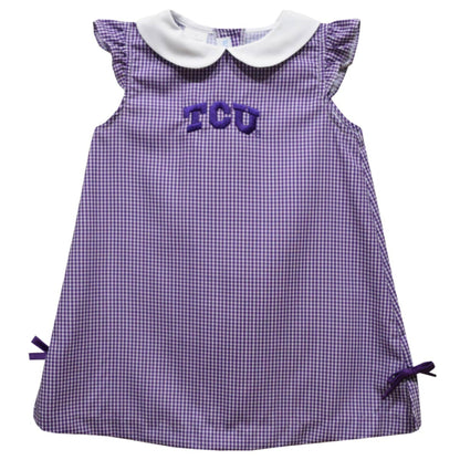 Purple checkered dress with 'TCU' lettering on a white background