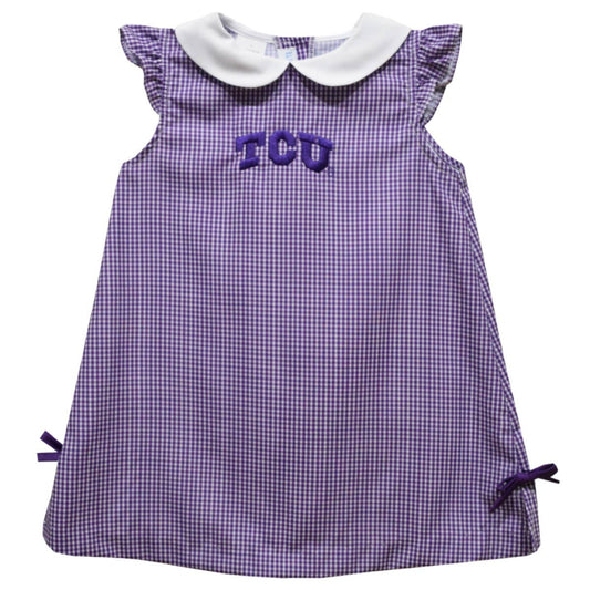 Purple checkered dress with 'TCU' lettering on a white background