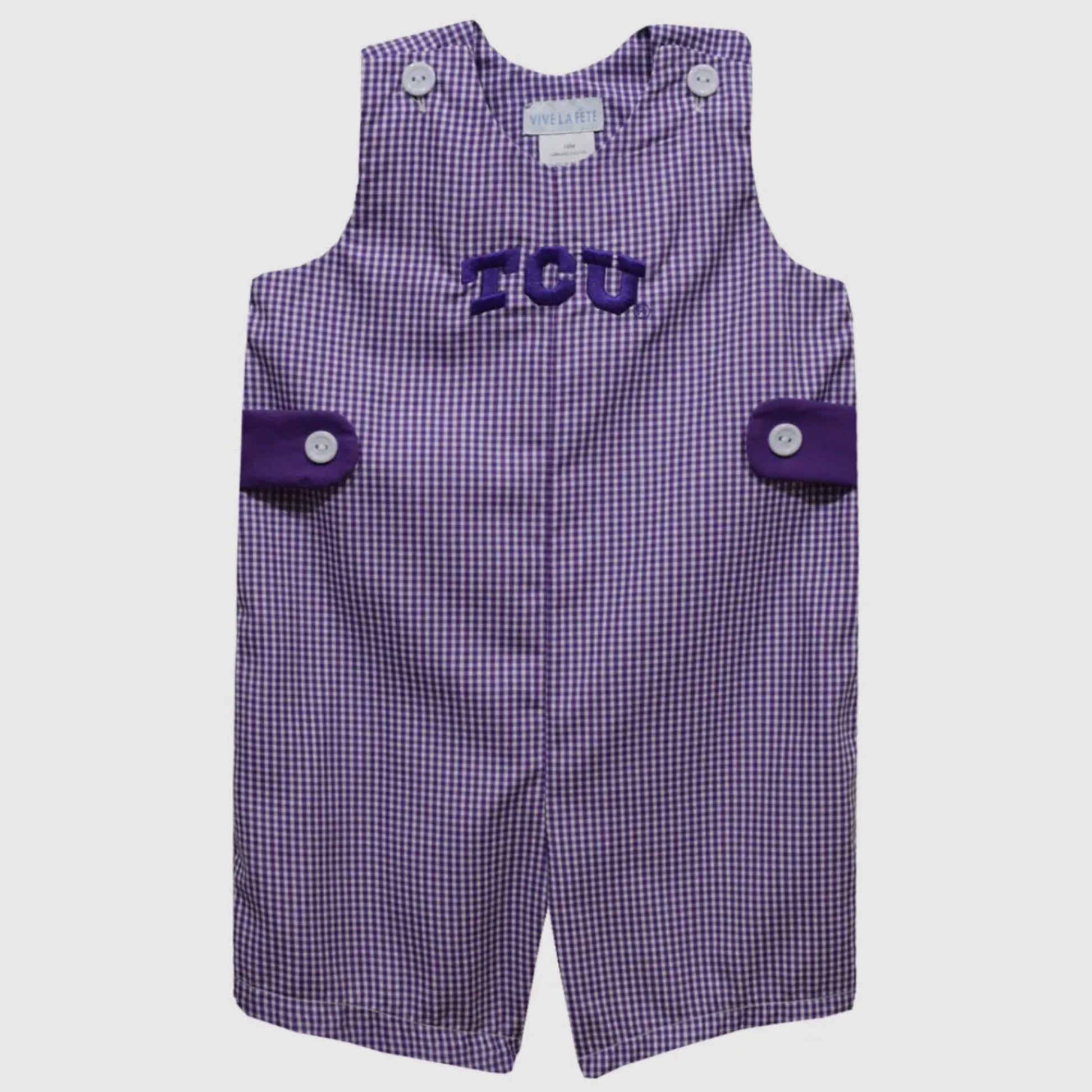 Purple checkered romper with 'TCU' logo on a white background