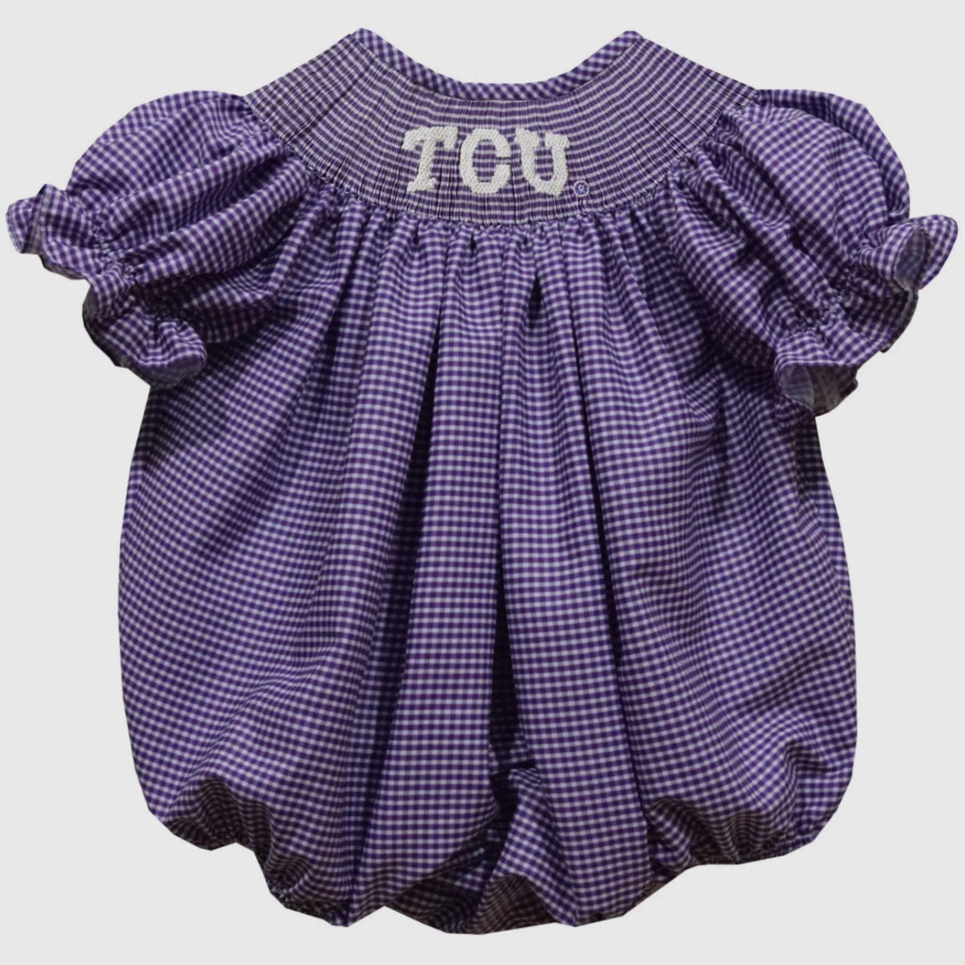 Purple checkered baby romper with 'TCU' text on a light gray background