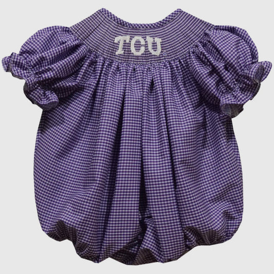 Purple checkered baby romper with 'TCU' text on a light gray background