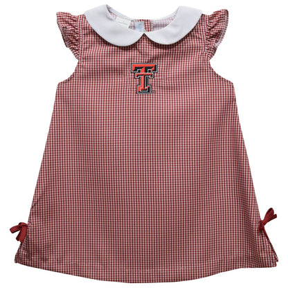 Red and white checkered dress with a collar and bow details on a white background