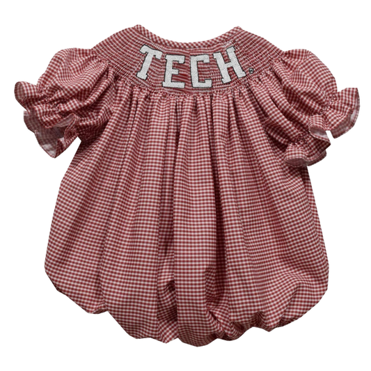 A toddler girl's short-sleeve romper in a red and white gingham pattern, featuring a smocked neckline with 'TECH' embroidered in white letters with a red outline.