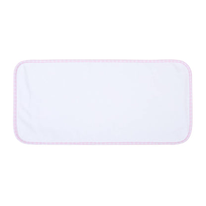 Rectangular white burp cloth with pink trim on white background
